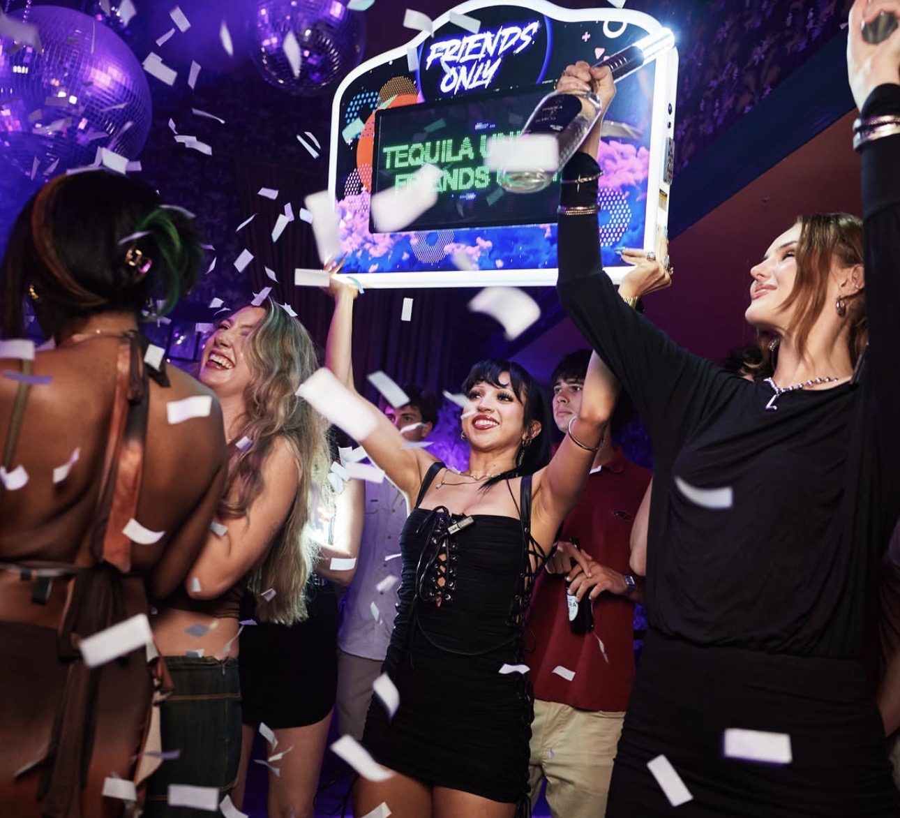 The Friends Only crowd celebrating with confetti and bottle service